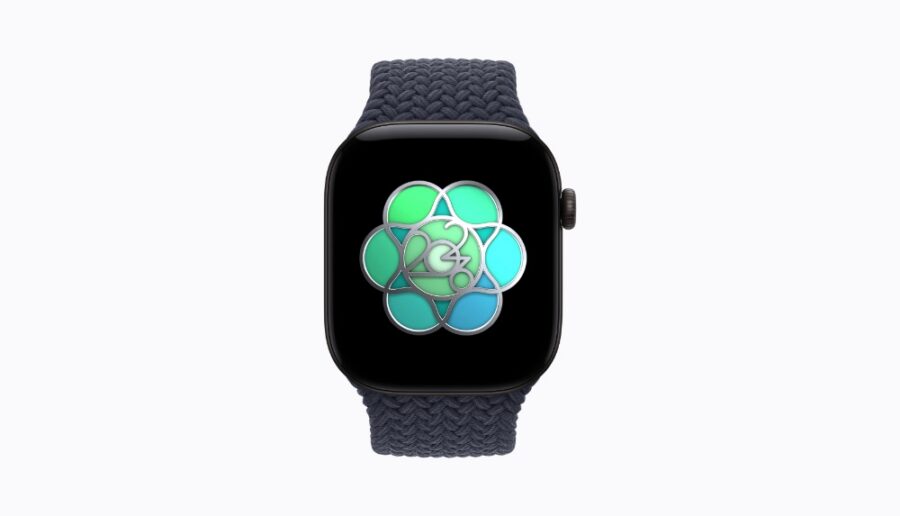 Eine Smartwatch mit einem farbigen, blumenähnlichen Symbol auf dem Display zum Welttag für psychische Gesundheit.